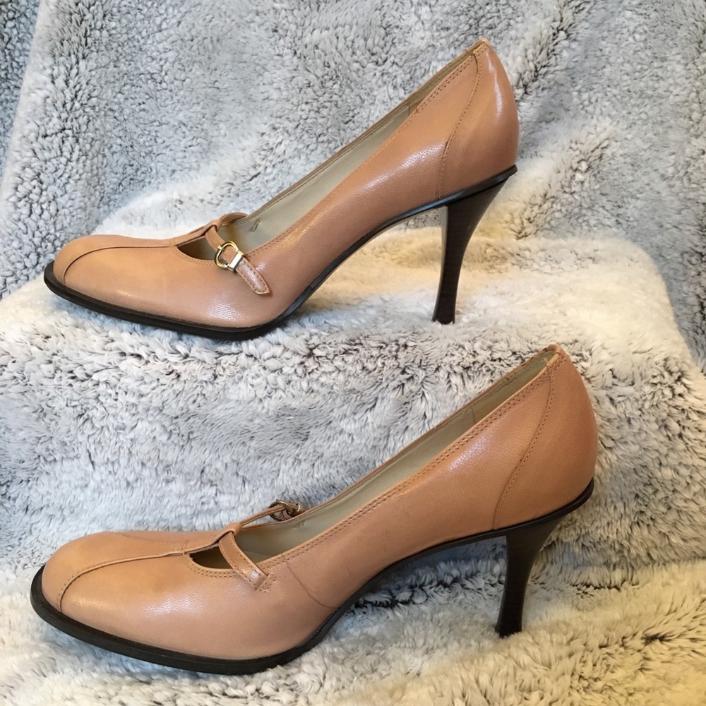 Nude/Pink BCBGIRLS pumps.